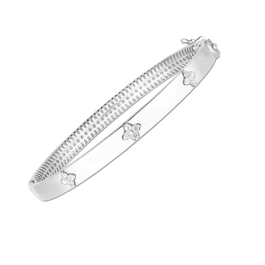 14K white gold bangle with three round diamond stones in a trilogy row