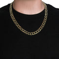 14K yellow gold Cuban curb chain in a 12.18 mm flat link pattern