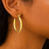 14k Yellow Gold Diamond Cut Textured Oval Hoop Earrings. thumbnail 2