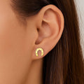14K yellow gold horseshoe earrings with a smooth open U-shape profile