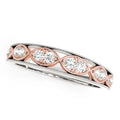 14K rose gold ring with round diamond stones in infinity pattern