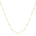 14K yellow gold textured Saturn bead necklace with hammered beaded strand