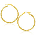 14K yellow gold textured large hoop earrings with slim 1.5mm profile