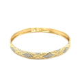 10K two-tone gold geometric bangle with round diamond accent stones