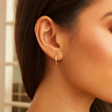 14k Yellow Gold Diamond Cut Textured Huggie Earrings thumbnail 3