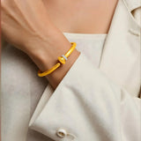 14K yellow gold hinged bangle bracelet with round diamond stones thumbnail 1