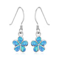 Sterling silver flower dangle earrings with opal center stones