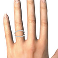 14K white gold split band ring with a row of round diamonds across the top