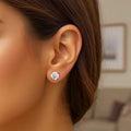 14K white gold stud earrings with 1 round faceted cubic zirconia stone