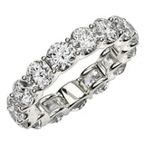 14K white gold eternity ring with round diamond stones around the full band thumbnail 1