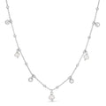 Rhodium plated sterling silver station necklace with pear pearl stones