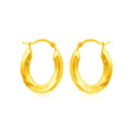 14K yellow gold oval hoop earrings with polished finish and no stones