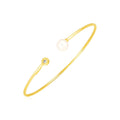 14K yellow gold cuff bangle with pear diamond and pearl accent