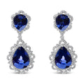 18K white gold drop earrings with blue sapphire and diamond halo stones