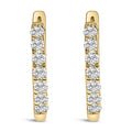 10K gold huggie hoop earrings with round diamond stones set on both sides