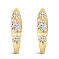 10K gold huggie hoop earrings with three round diamond stones in a row