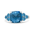 18K white gold ring with 3 cushion blue topaz and diamond stones