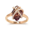 14K rose gold ring with round diamond wrap around a purple amethyst center