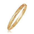14K yellow gold domed bangle with woven weave motif surface