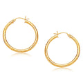 14K yellow gold hoop earring with diamond-cut faceted finish, 30 mm diameter