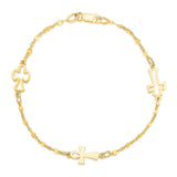 14K yellow gold cross bracelet with linked symbolic cross design thumbnail 1