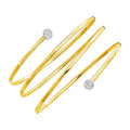14K two-tone gold spiral bangle with round diamond stones