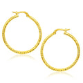 14K yellow gold round tube textured hoop earrings