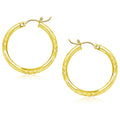 10K yellow gold diamond-cut 25mm hoop earrings with faceted surface