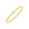 14K yellow gold stretch bangle with round diamond stones