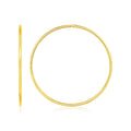 14K yellow gold endless hoop style ring with smooth clasp-free profile