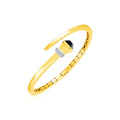 14K yellow gold crossover hinged bangle with onyx and round diamond stones