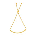 14K yellow gold curved bar and lariat style bracelet