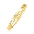 14K yellow gold dome bangle with Florentine textured finish