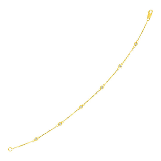 14K yellow gold bracelet with diamond stations along a fine chain