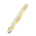 10K two-tone gold textured zigzag bangle with no stones